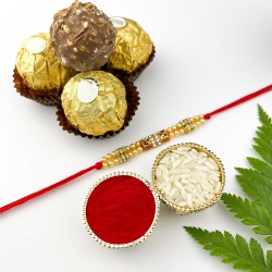 Pure Ecstasy Gold Beads Rakhi N 3 Ferreros to Rakhi-to-canada.asp