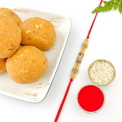 Glossy Stone Rakhi with Besan Laddoo Twist to Rakhi-to-canada.asp