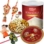 Charming Combo Of Bhaiya Bhabhi Rakhi Set, 2 Kid Rakhi, Mixed Dry Fruits, Haldiram Rasgulla And Pooja Thali. to Rakhi-to-canada.asp