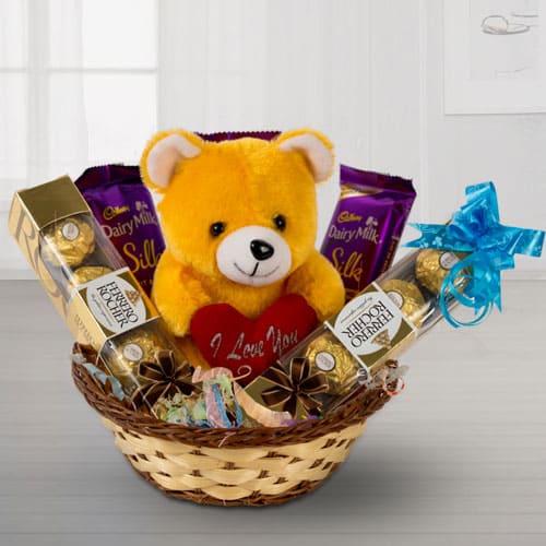 Delightful Chocolates with Love Teddy in a Basket to Alwaye