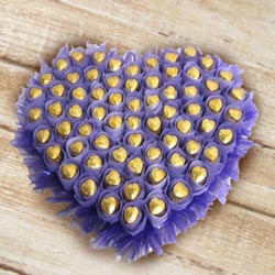 Yummy Heart Shaped Arrangement of Homemade Chocolates to Kollam