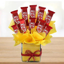 Remarkable Arrangement of Kitkat Chocolates in Glass Vase to Chittaurgarh