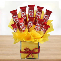 Remarkable Arrangement of Kitkat Chocolates in Glass Vase to Marmagao