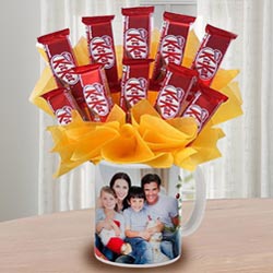Enticing Kitkat Chocolates Arrangement in Personalized Coffee Mug to Marmagao