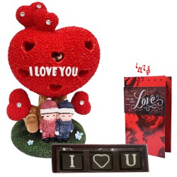 Magnificent Combo of Couple Statue with Chocolate N Musical Greetings Card