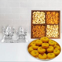 Appealing Ganesh Lakshmi Idol with Dry Fruits N Haldirams Kesaria Peda to Irinjalakuda