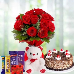 12 Exclusive Red Roses Bouquet with Cake 1 Lb, Cadburys Assorted Chocolates and a Cute Teddy Bear