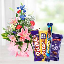 Unique seasonal Flowers including yummy assorted Cadburys Chocolate