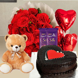 Attention-Getting Red Roses, Chocolate Cake, Mylar Balloons, Chocolates and a Teddy