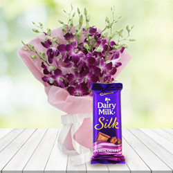 Wonderful Bouquet of Orchids and Cadbury Dairy Milk Silk to Alwaye