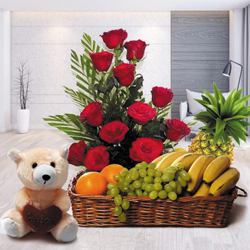 Carefully Selected Fruits Basket with Radiant Red Roses Arrangement and Sweet Teddy
