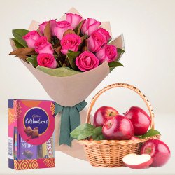 Sweet Selection of Cadbury Celebration with Fresh Apples Basket and Bouquet of Roses