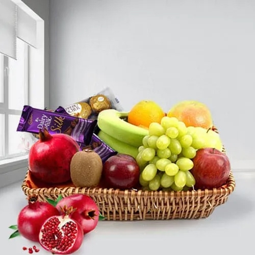 Tasty Fruits Basket with Assorted Chocolates to Alwaye
