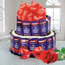 Wonderful 2 Tier Arrangement of Cadbury Dairy Milk Chocolates with Single Red Rose