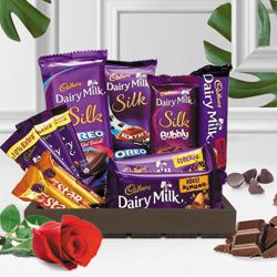 Delectable Chocos Gift Basket with Single Red Rose