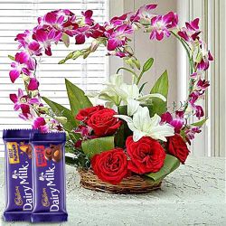 Hearty Basket of Roses, Orchids n Lilies with Cadbury Chocolates