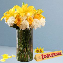 Fascinating Love Mixed Flowers in Glass Vase with Toblerone