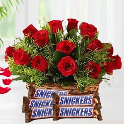 Glamorous Red Roses Basket n Snickers Peanut Bar Gift Combo