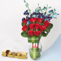 Excellent Red Roses n Blue Orchids in a Glass Vase with Ferrero Rocher Box