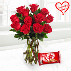 Exclusive Red Dutch Roses in vase with Cadburys Chocolate