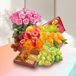 Scrumptious Fresh Fruit Basket with Haldiram Soan Papdi and Rose Bouquet to Sivaganga