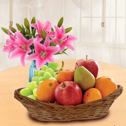 Tasty Fresh Fruits Basket with Pink Lilies to Mavelikara