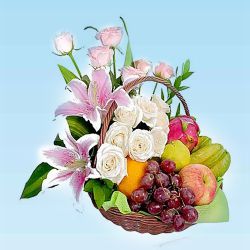 Mouth Watering Fresh Fruits Basket Decorated with Lily and Roses
