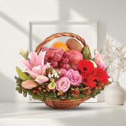 Artistic Basket of Fresh Fruits decorated with Lily, Roses n Gerberas