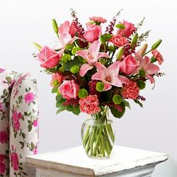 Magnificent arrangement of fresh Lilies Roses and Carnations
