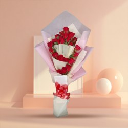 Charming Tissue Wrapped Bouquet of Red Roses