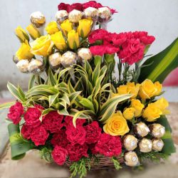Designer Arrangement of Assorted Flowers with Ferrero Rocher Chocolate to Marmagao