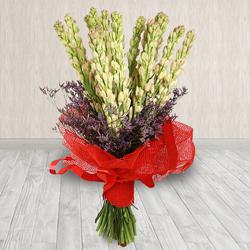 Elegant Hand-Designed Bouquet of Rajnigandha in Tissue Wrapping to Uthagamandalam