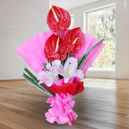 Elegant Bouquet of Red Anthodium n Pink Lilies to Alwaye