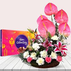 Exclusive White N Pink Flowers Arrangement with Chocolates to Irinjalakuda