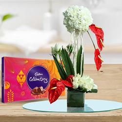 Beautiful Flowers Arrangement in Glass Vase with Cadbury Celebration to Sivaganga