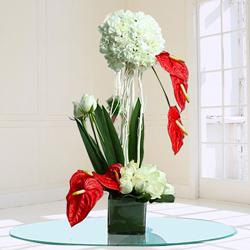 Remarkable Assorted Flowers Arrangement in Glass Vase to Punalur