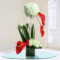 Remarkable Assorted Flowers Arrangement in Glass Vase to Alwaye