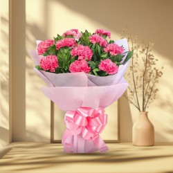 Order this mesmerizing Hand Bouquet of Pink Carnations in tissue wrapping