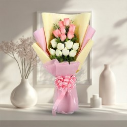 Exquisite Floral Arrangement of Baby Pink N White Roses adorned with White Foliage