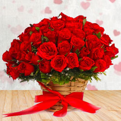 Delightful Basket arrangement of Red Roses with Filler Flowers
