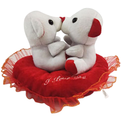 Scintillating Kissing n Singing Teddy in a Heart Shape Cushion