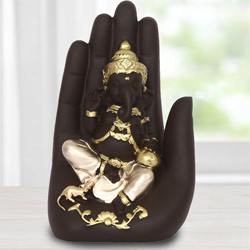 Exquisite Handcrafted Palm Ganesha Showpiece to Adipur