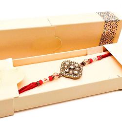 Charming Stone Studded Rakhi in Stellar Box to Rakhi-to-newzealand.asp