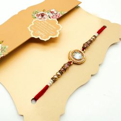 Glittering Stone Work Rakhi on Card to Rakhi-to-newzealand.asp