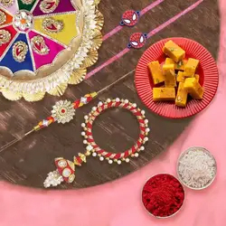 Charming Gift of Mysore Pak, 1 Bhaiya Bhabhi Rakhi, 2 Kids Rakhi and 1 Rakhi Thali to Rakhi-to-uk.asp