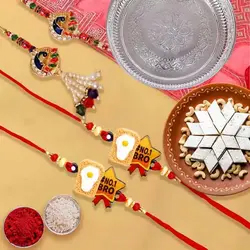 Irresistible Kaju Katli with One Bhaiya Bhabhi Rakhi Set and 2 Kids Rakhi in 1 Puja Thali to Uk-rakhi-thali.asp