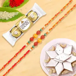 Rudraksha Rakhi with Ferrero Rocher N Kaju Katli to Uk-rakhi-sweets.asp