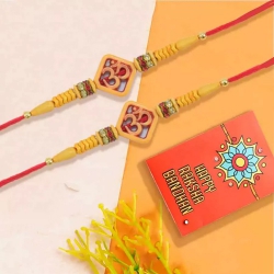 Charming Om Rakhi Pair with Roli Chawal Tika n Rakhi Card to Rakhi-to-usa.asp