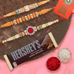 Classic Set of 3 Rakhi with Hersheys Chocolate, Roli Tika n Card to Rakhi-to-usa.asp