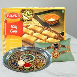 Delightful Pack of Rakhis with Puja Thali N Milk Cake to Rakhi-to-usa.asp